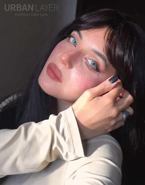 Woman wearing Angeles N Emerald blue-green colored contact lenses by Urban Layer Korea.