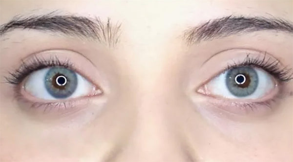 April Blue colored contacts by Urban Layer in flash/bright light