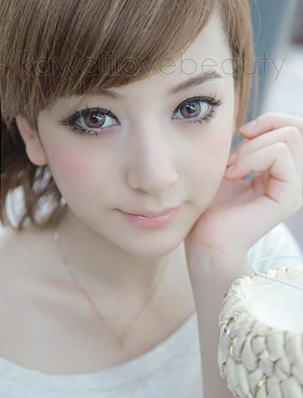 Puffy 3 Tones Pink circle lenses by Dueba Barbie on model with brown eyes in natural light