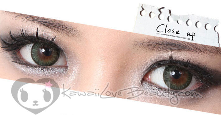 Closeup on brown eyes, Geo BS203 Bella Green soft colored contact lenses.