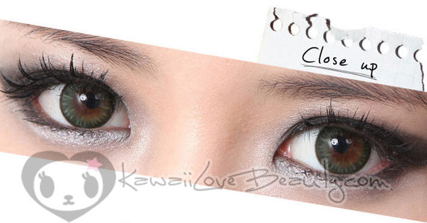 Closeup on brown eyes, Geo BS203 Bella Green soft colored contact lenses.
