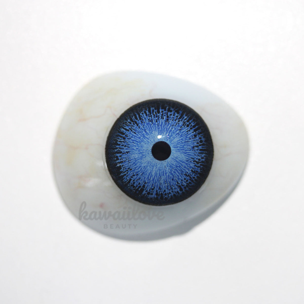 Interstellar Blue colored contact lens displayed over model of dark brown eye. These vibrant blue circle lenses ship fast from the United States.