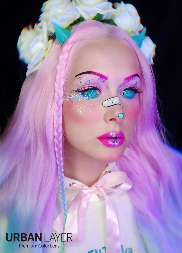Crazy Lab Cyan Mesh R Mini sclera colored contacts circle lenses on model in pastel goth attire, pink hair and makeup with a flower crown. These silcone hydrogel blue screen special effects colored contacts ship fast and free from the USA.