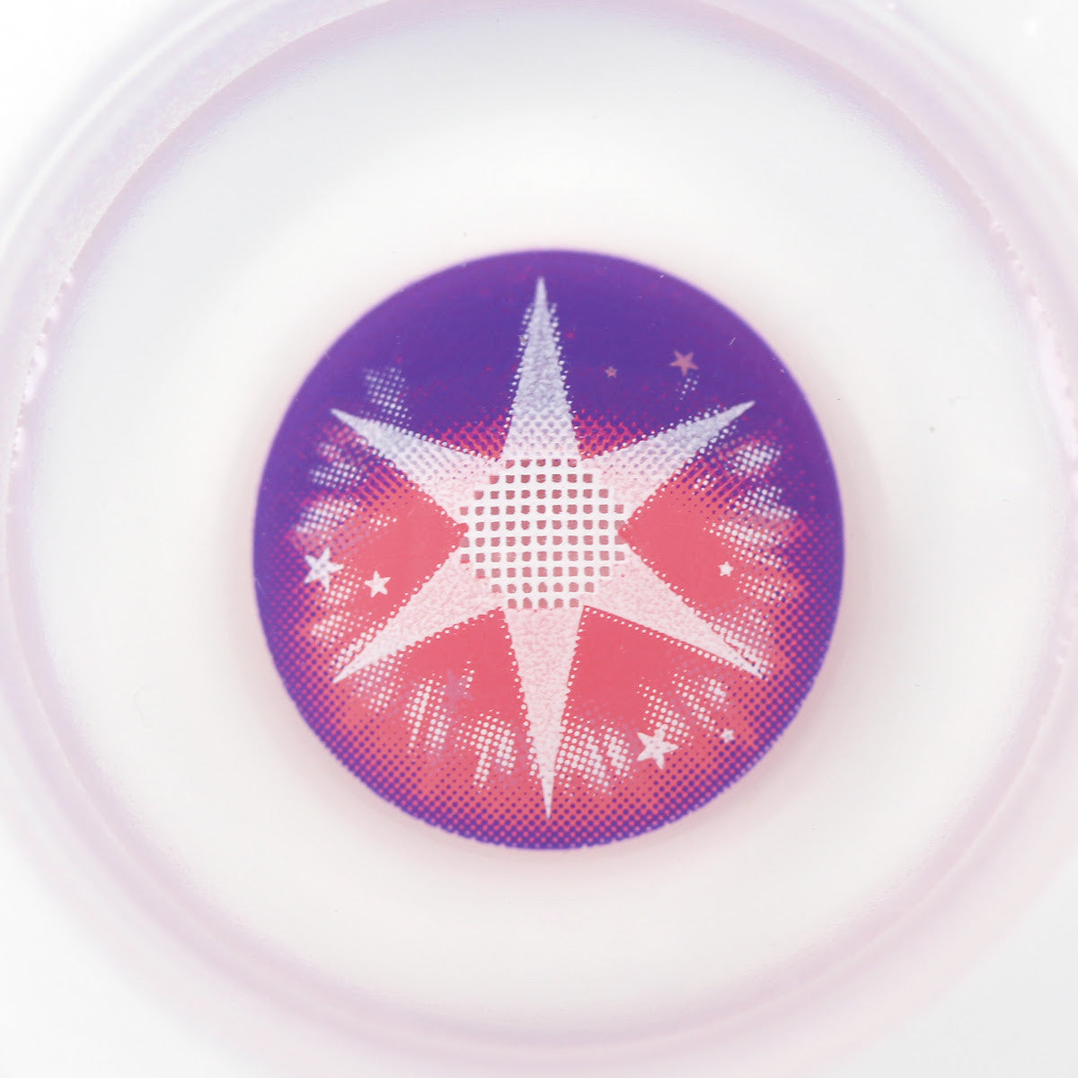 A circular cosmetic product, likely a contact lens or gel pad, featuring a purple and red gradient background with a white starburst pattern in the center.