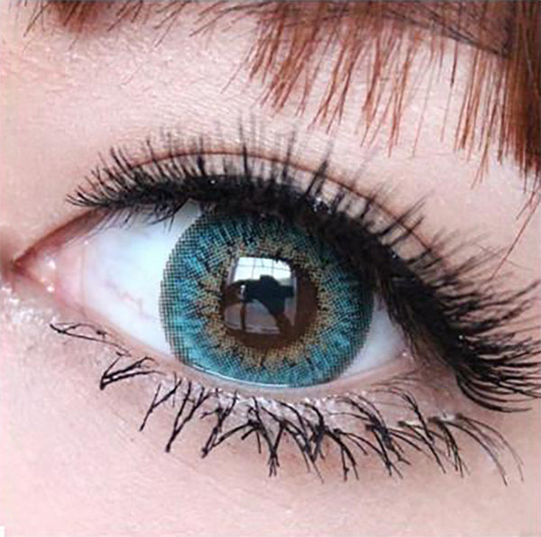 Closeup on design detail of Puffy 3 Tone Turquoise circle lenses