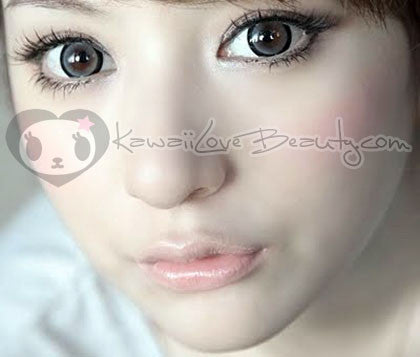 WIA25 grey circle lens on model with brown eyes in natural lighting.