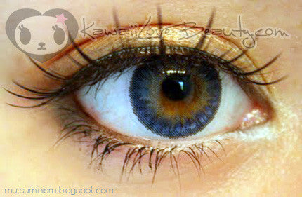 Closeup on Geo Berry Holic Sapphire Blue CM952 circle lens on brown eye. 