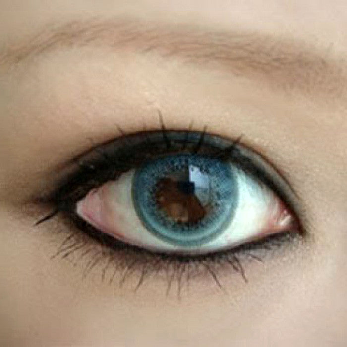 Closeup on GEO OL102 Olive (Wing) Blue circle lens on dark eye