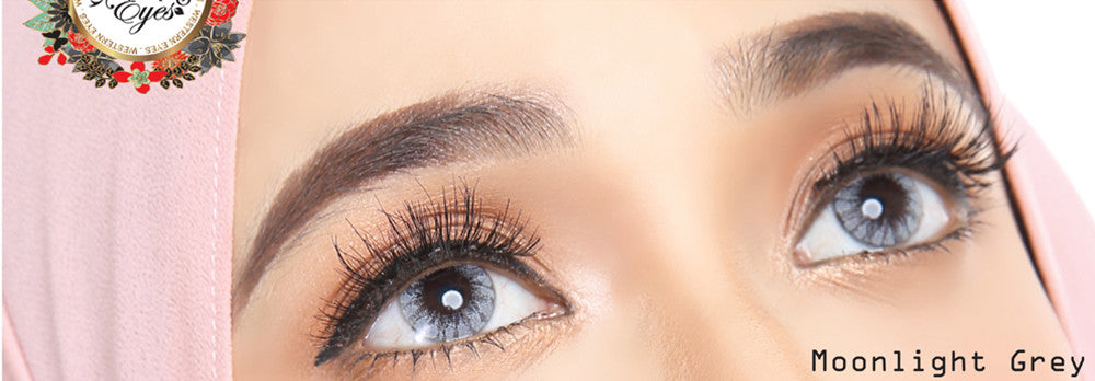Moonlight Grey circle lenses on dark eyes with bright flash photography
