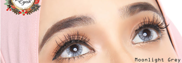 Moonlight Grey circle lenses on dark eyes with bright flash photography