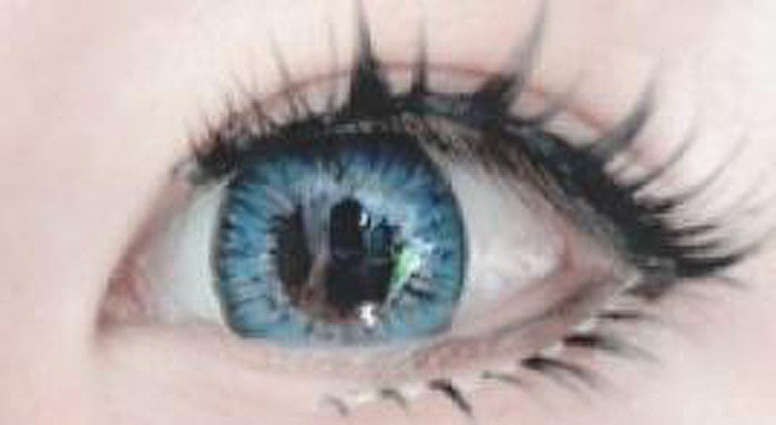 Closeup on brown eye with Sea Blue circle lens