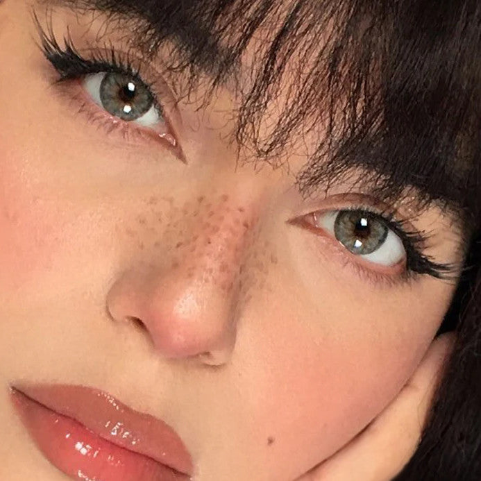 Urban Layer Cleopatra Gray contacts on dark brown eyes, manufactured by Urban Layer Korea. These grey lenses ship fast from the USA.