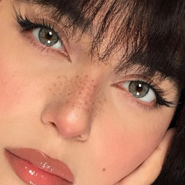 Urban Layer Cleopatra Gray contacts on dark brown eyes, manufactured by Urban Layer Korea. These grey lenses ship fast from the USA.