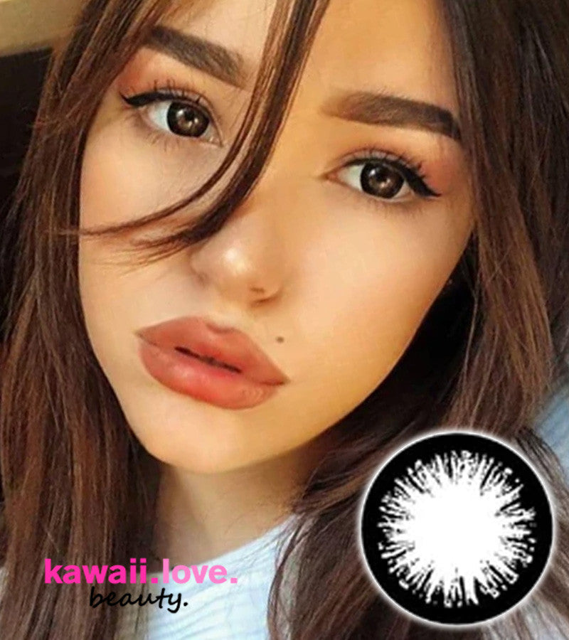 Our smouldering Dark Night black circle lenses are 100% authentic and made in Korea. These dolly black lenses emphasize and enlarge your eyes with a thick black limbal ring encircling the outer rim. Dark Night Black circle lenses ship fast from the USA and come with a free contact lens case.