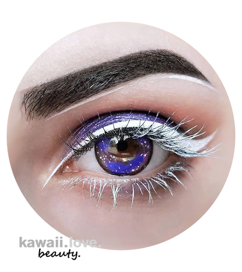 With these incredible Galaxy Violet circle lenses from Urban Layer Korea, you can gaze into the enchanted marvel of a distant galaxy. These striking and ethereal 3-toned purple colored contacts have an outer limbal ring that gives the appearance of a starry night while also giving an enlarging effect to the eyes. They are ideal for astro-princes and princess costumes as well as for daily wear. Each set of cute contact lens case and spacey Galaxy Violet circle lenses delivers fast from the USA.