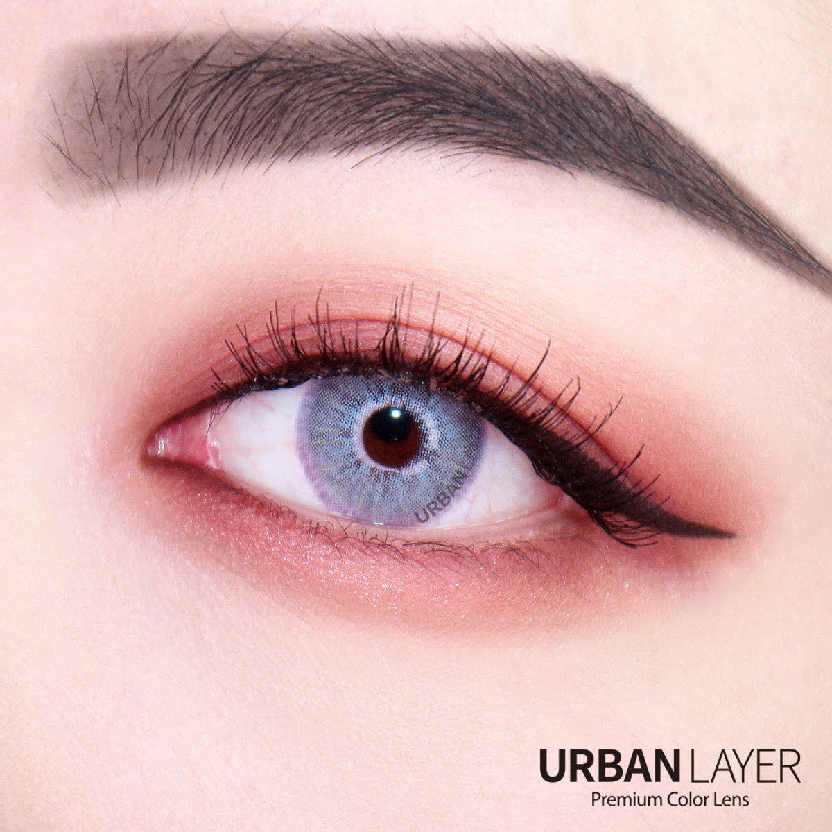 Las Vegas N Ash Blue circle lens colored contacts by Urban Layer on dark brown eyes. Fast shipping available for these beautiful blue lenses for the USA.