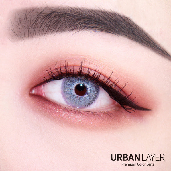 Las Vegas N Ash Blue circle lens colored contacts by Urban Layer on dark brown eyes. Fast shipping available for these beautiful blue lenses for the USA.