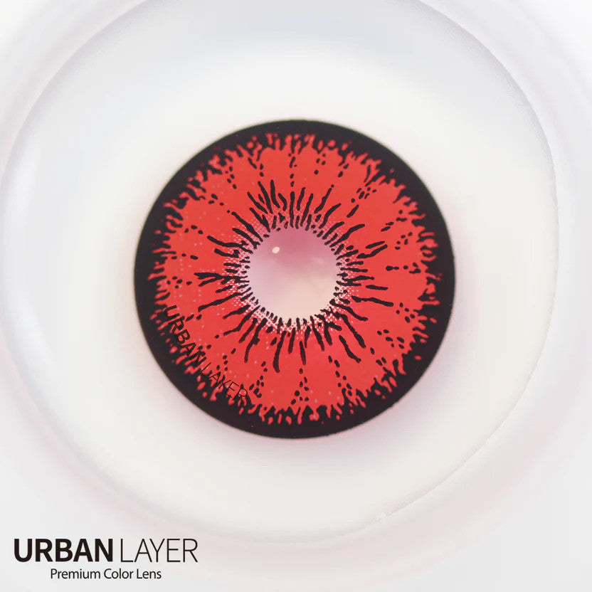 Tokyo N Red Circle Lenses featuring a vibrant red hue with a thick black limbal ring for a bold, doll-like anime look. Crafted from silicone hydrogel for all-day comfort, perfect for cosplay or making a dramatic fashion statement. Available with fast shipping in the USA.