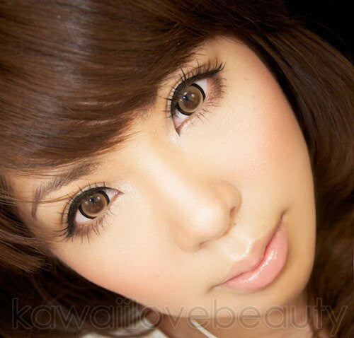 Sugar Candy brown circle lenses on model with dark brown eyes.